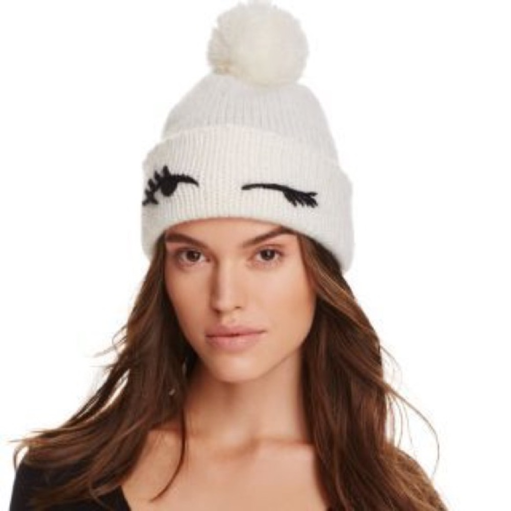 kate spade ♠️ Winking Eyes Pom Pom Beanie in cream